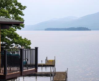 A Lake George resort with a deck overlooking the water.